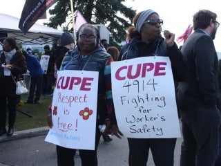 Image:  Striking members of CUPE 4914