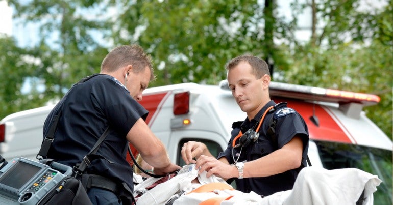 Emergency services sector: Paramedics transport a patient