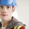 Young worker with safety hat and vest