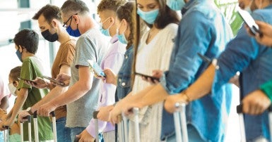 People waiting in line at an airport