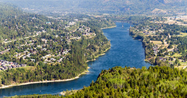 Overhead view of a city with a river running through it