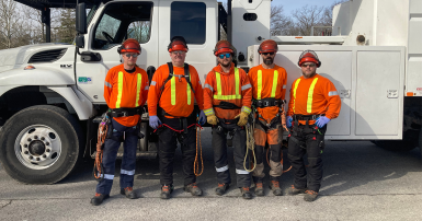 Guys standing in front of a truck