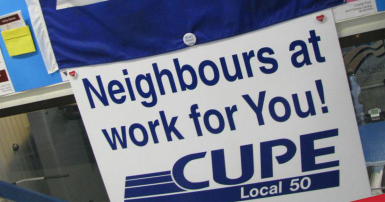 Sign that reads CUPE 50 Neighbours at work for you 