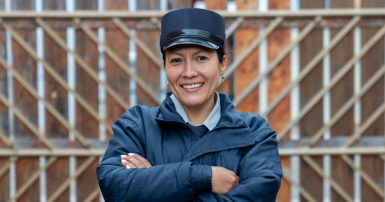 Portrait of happy woman working as security guard 