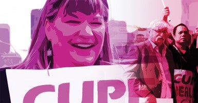 Stylized photo of a smiling woman holding a picket sign, with a group with picket signs in the background.