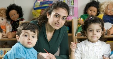Child care worker with two children