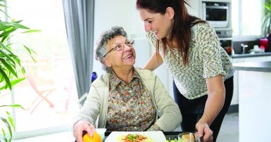 Home support worker and patient at breakfast