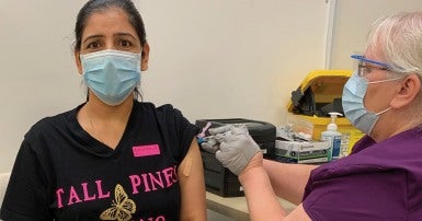 Pam Hayer, CUPE member, getting a COVID vaccine