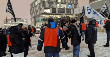 Workers protesting in front of Laval city council