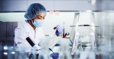 Asian health care worker in a lab