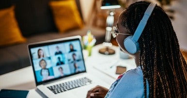 Woman with headphones in a meeting