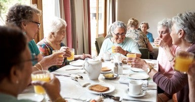 Seniors eating in a long-term care home
