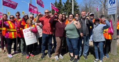 CUPE National President Mark Hancock and MPP Jeff Burch with striking workers