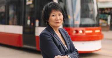 Olivia Chow in front of a TTC streetcar