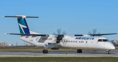 Westjet Encore plane on the runway