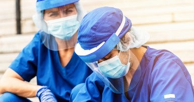Health care workers with face coverings