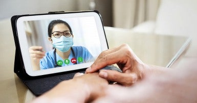 Person speaking with their doctor using video chat