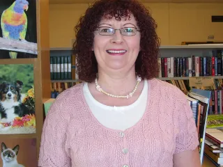 Photo of Patricia Mayo in the library