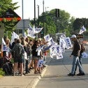 Striking workers holding SCFP flags