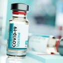 Vial with label that says COVID-19 vaccine
