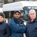 CUPE 561 transit operators in front of a not in service bus