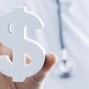 Doctor holding a dollar sign