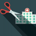 Flat drawing of hospital with big scissors ready to cut it in half