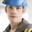 Young worker with safety hat and vest