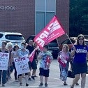 OSBCU members rally in front of a public school