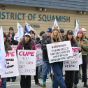 People standing with picket signs