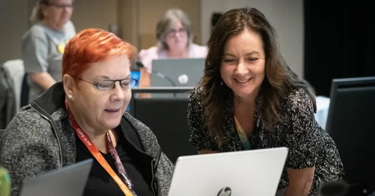 CUPE members at a laptop