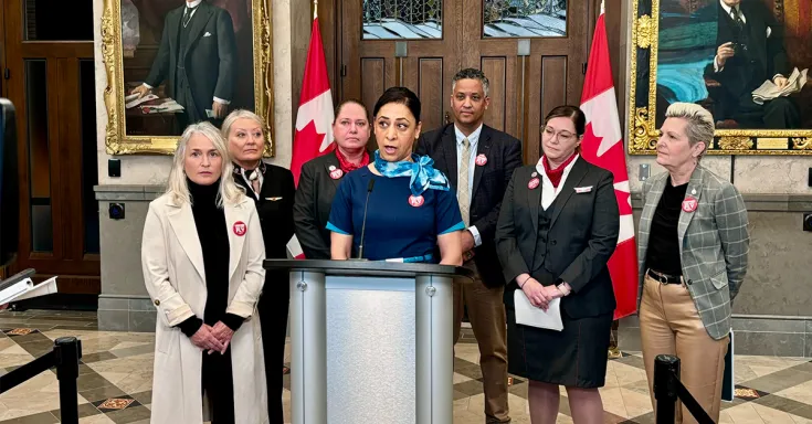 People at a podium for a press conference
