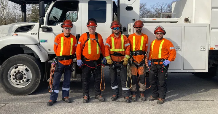 Guys standing in front of a truck