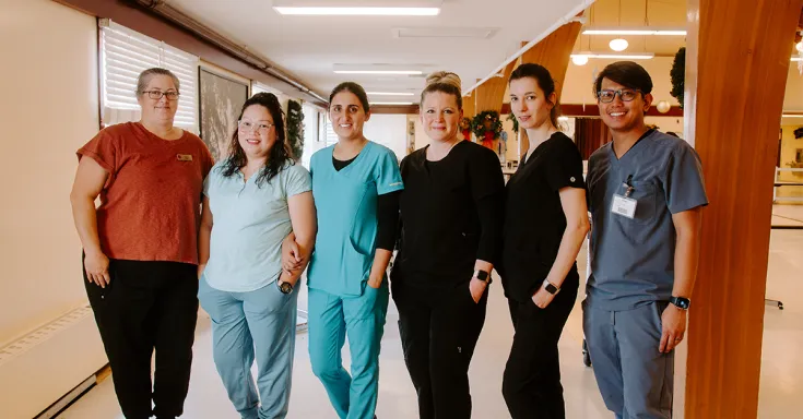 Hospital staff standing in a hallway