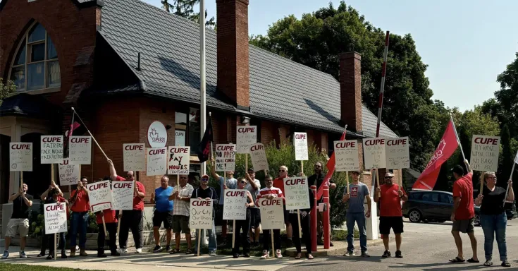 People holding picket signs
