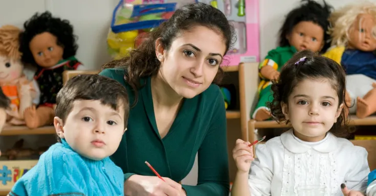 Child care worker with two children