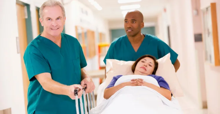 Hospital orderlies with patient