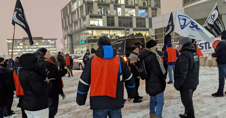 Workers protesting in front of Laval city council