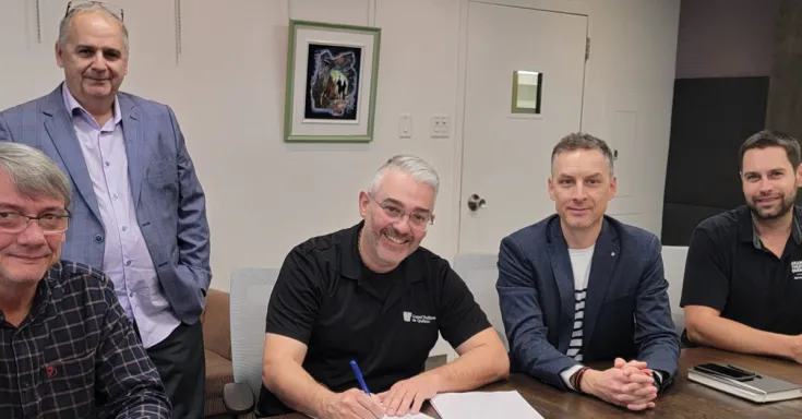 Members of the bargaining committee at negotiation table.