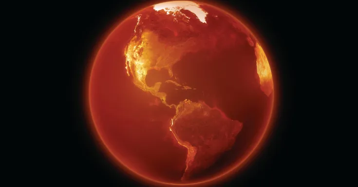 The earth tinted orange as if burning on black background