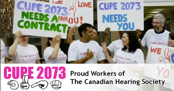 Group of men and women in white t-shirts that say CUPE 2073 holding signs at rally 