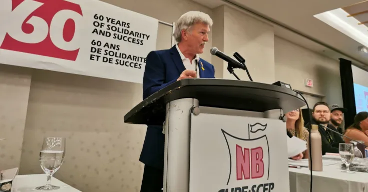 Stephen Drost addresses delegates at the CUPE New Brunswick convention