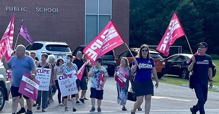 OSBCU members rally in front of a public school