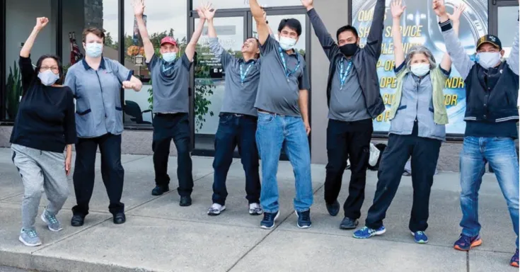 Photo of HEU members at CUPE celebrating the reversed privatization of jobs in hospitals and long-term care homes.